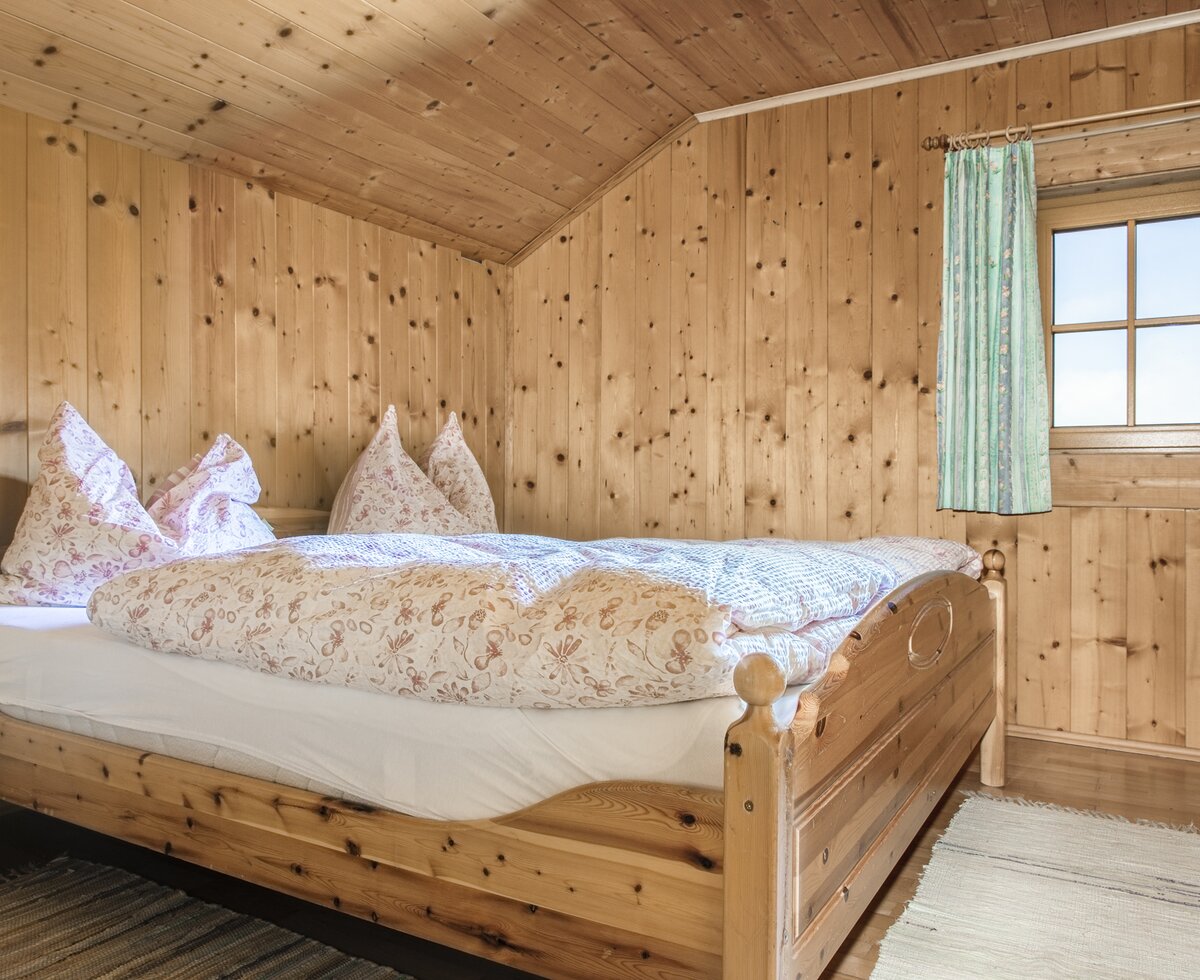 Schlafzimmer auf der Ebenhütte | © Urlaub am Bauernhof im SalzburgerLand / Bernd Suppan Schlafzimmer auf der Ebenhütte | © Urlaub am Bauernhof im SalzburgerLand / Bernd Suppan
